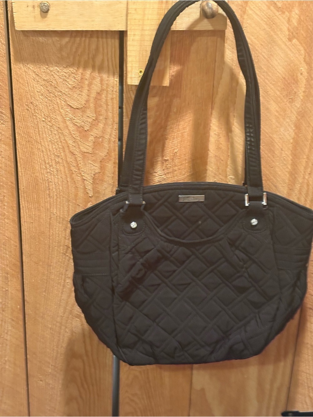 Quilted Black Vera Bradley Brand handbag.